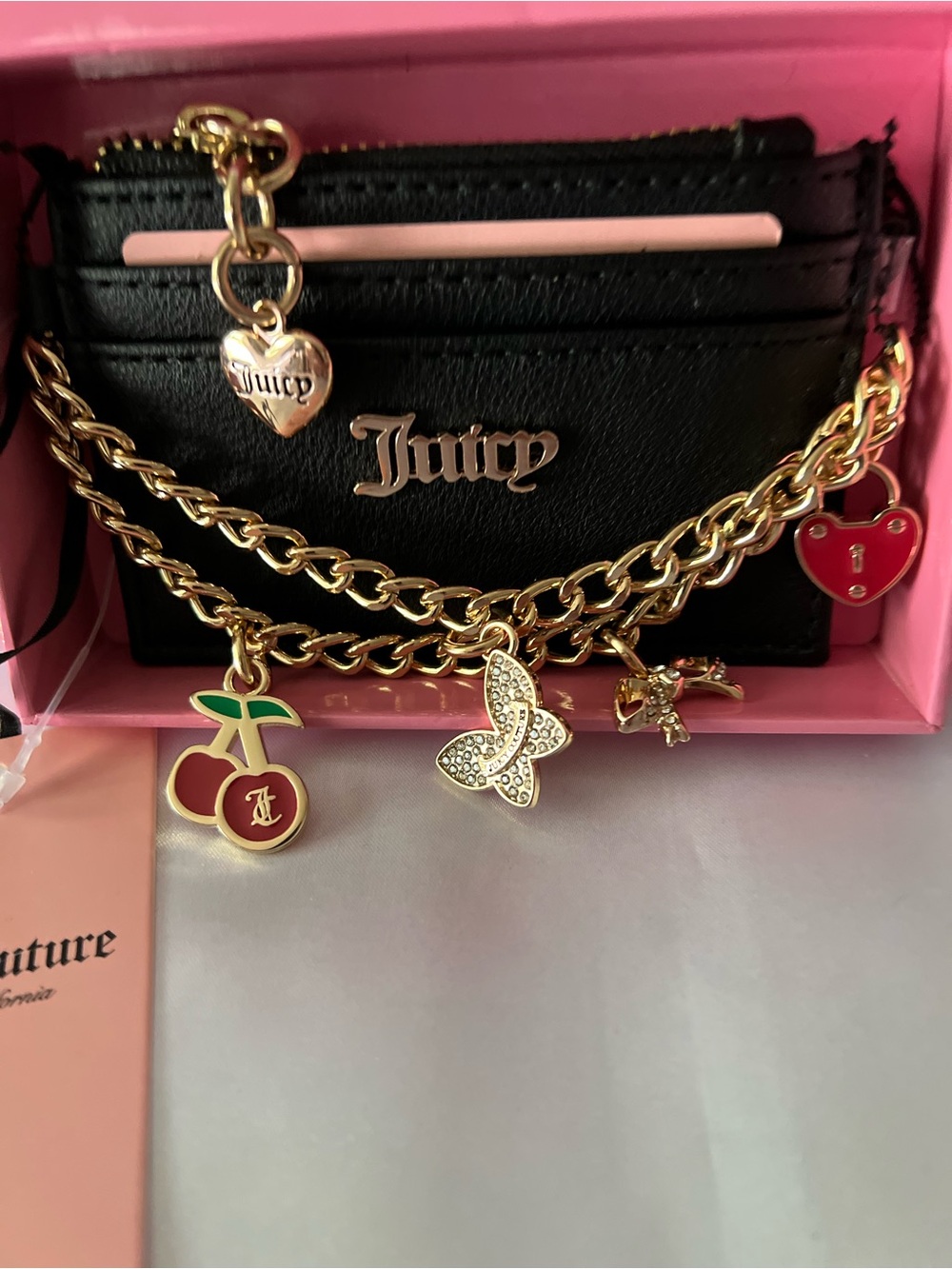 Juicy Couture Black Card & Key Holder with Gold Chain and Red Charm Accents